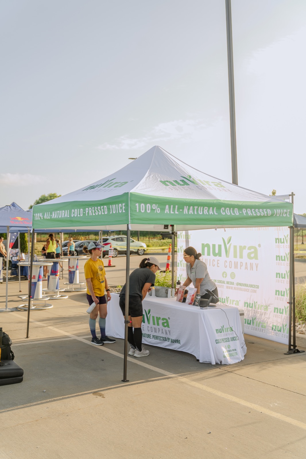 NuVira booth serving customers at a local wellness event